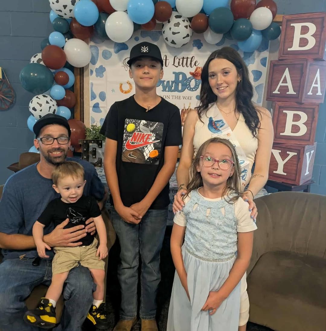 A father with his family at a community event